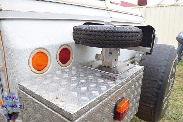 Boat trailer wheel carrier